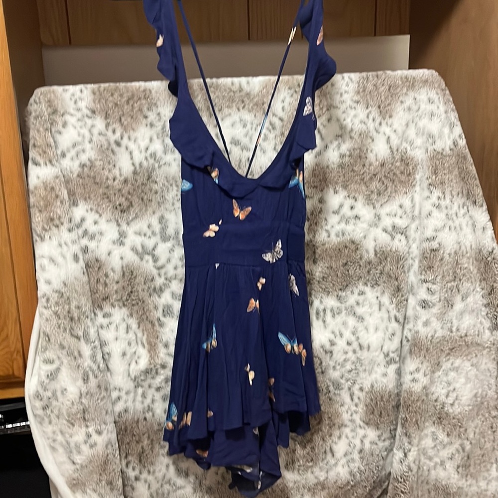 New with tag. Urban outfitters size small. romper. Blue. Butterflies.